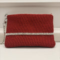 Pochette da polso red wine con fascia luminosa argento